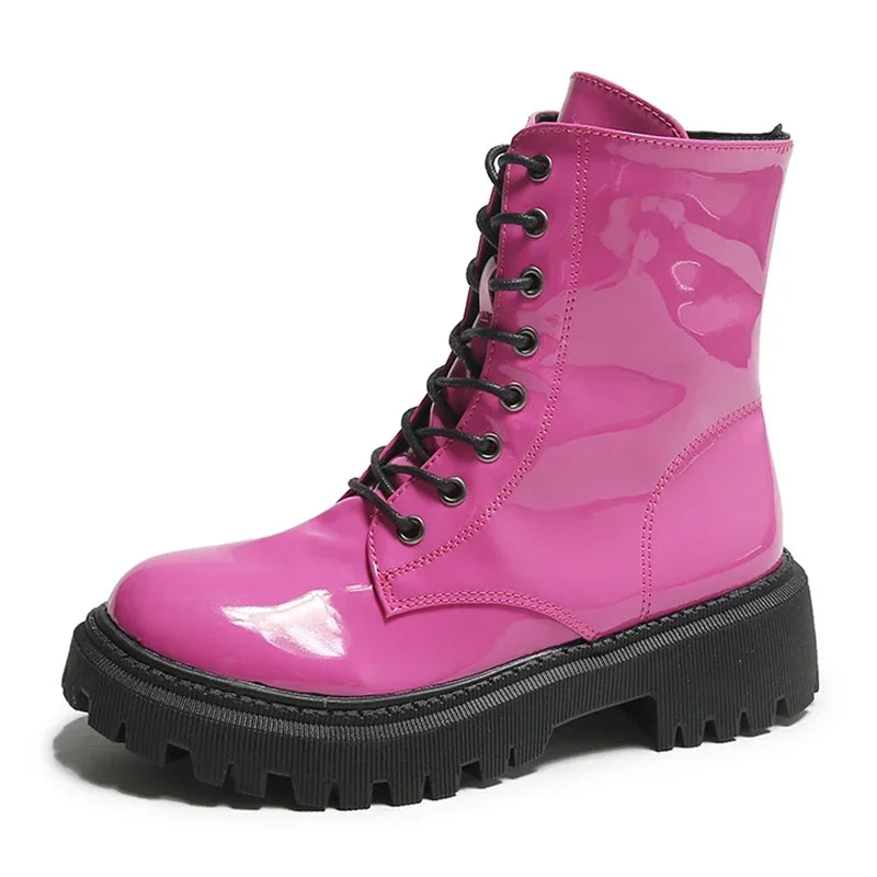 Pink women's lace-up moto boots by Corporación Turística, featuring a stylish design and sturdy sole for casual or motorcycle wear.