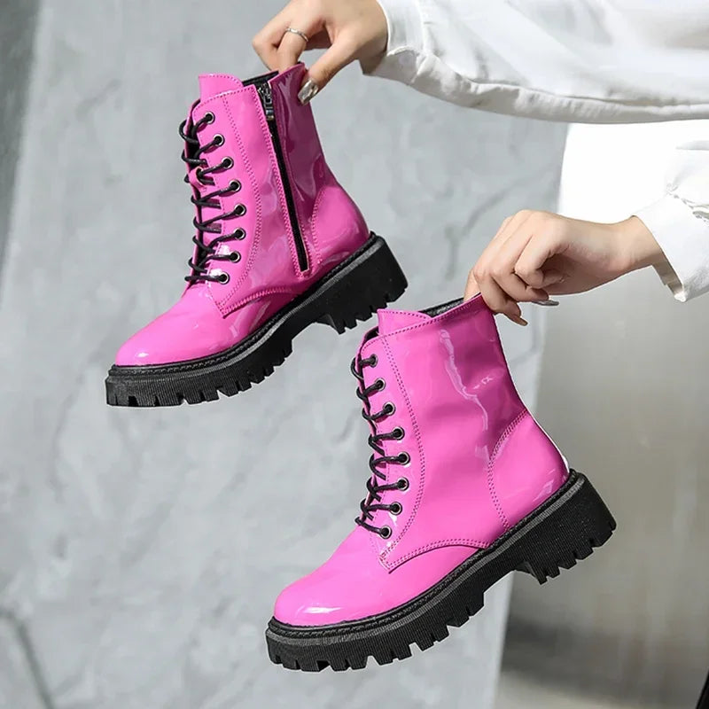 Pink women's combat boots with laces, motorcycle-style ankle boots by Corporación Turística, featuring a sturdy sole and stylish design.
