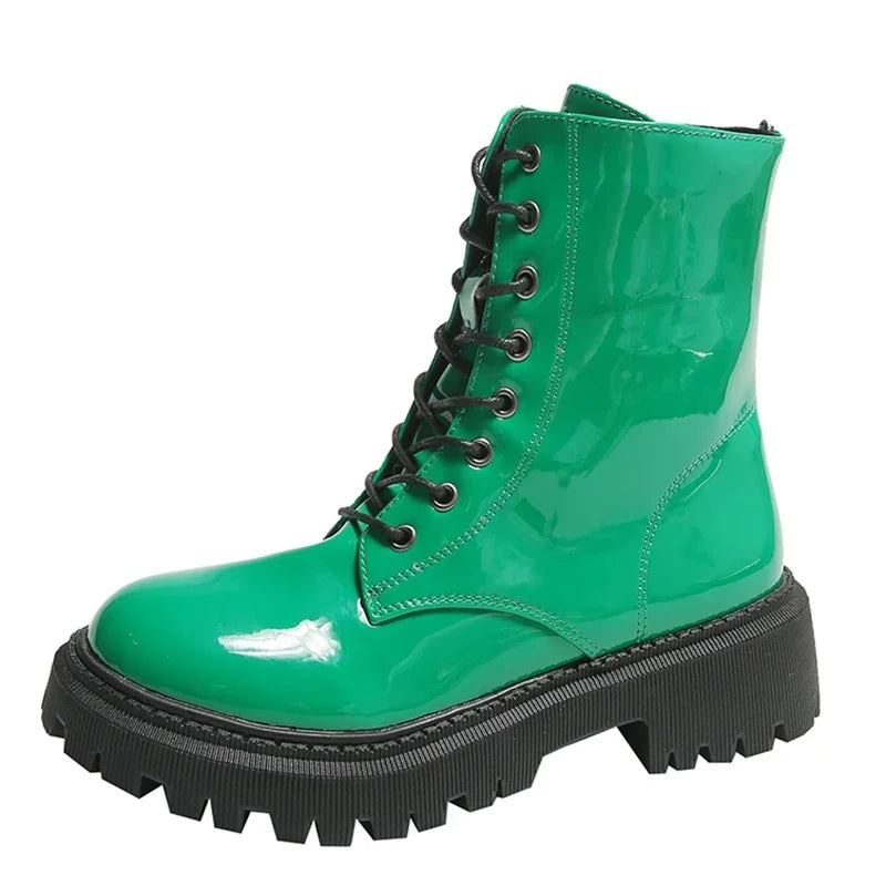 Pink women's lace-up motorcycle boots with a chunky sole, stylish and durable footwear by Corporación Turística.