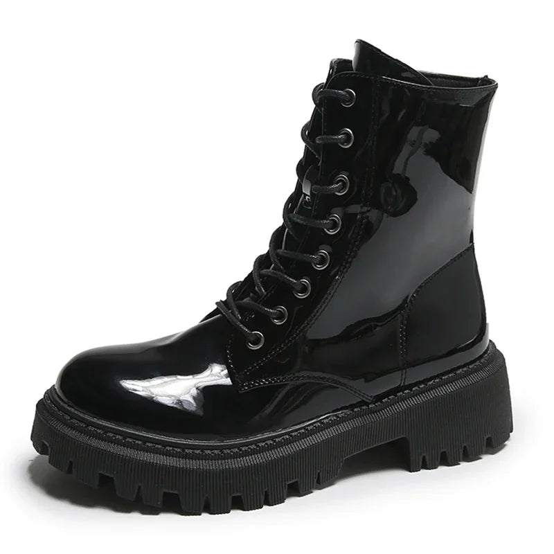 Pink lace-up women's motorcycle boots by Corporación Turística, stylish ankle boots with a rugged sole and modern design.