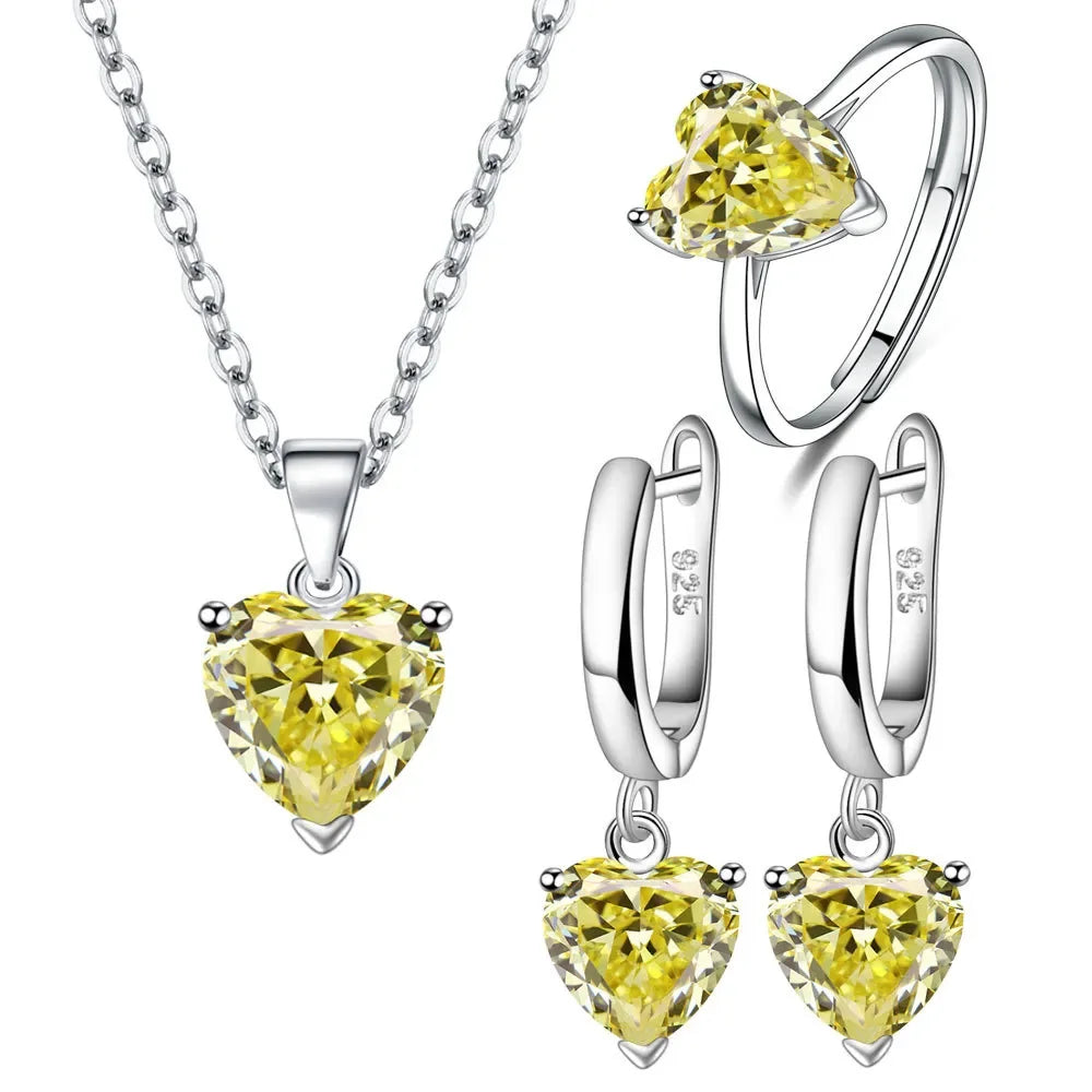 Silver jewelry set for women featuring a necklace and earrings made of 925 sterling silver, with elegant design and green accents.