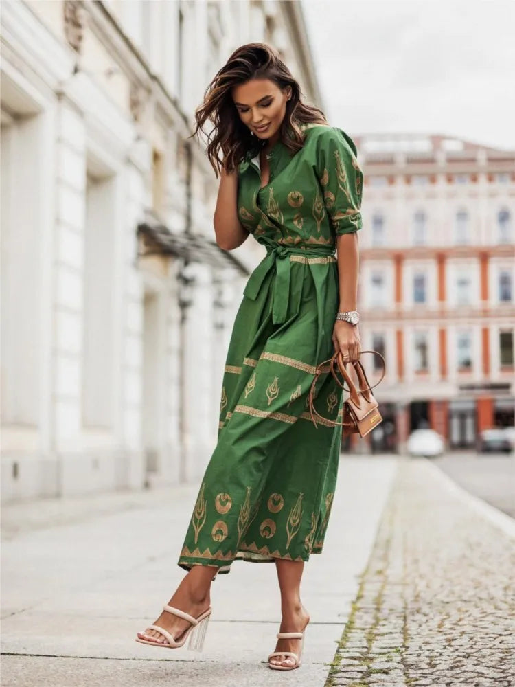 Green short-sleeve spring and fall women's fashion top by Corporación Turística, featuring a modern, stylish design.