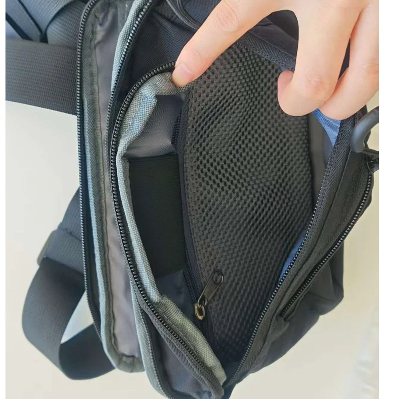 Gray tactical waist bag for men by Corporación Turística, ideal for hiking and climbing outdoor activities.