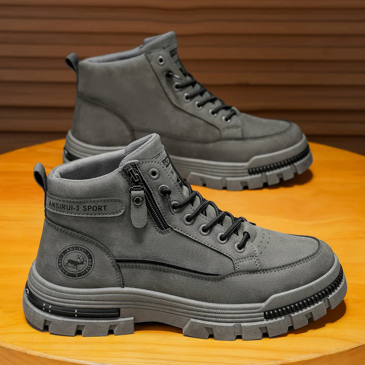 Gray high-calf denim boots for men by Corporación Turística, featuring a stylish, rugged design and durable construction.