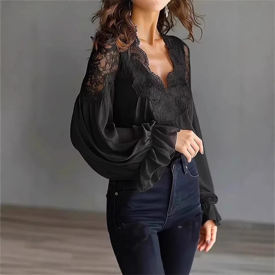 White lace blouse with deep V-neck and long sleeves, shown on a model, from Corporación Turística.