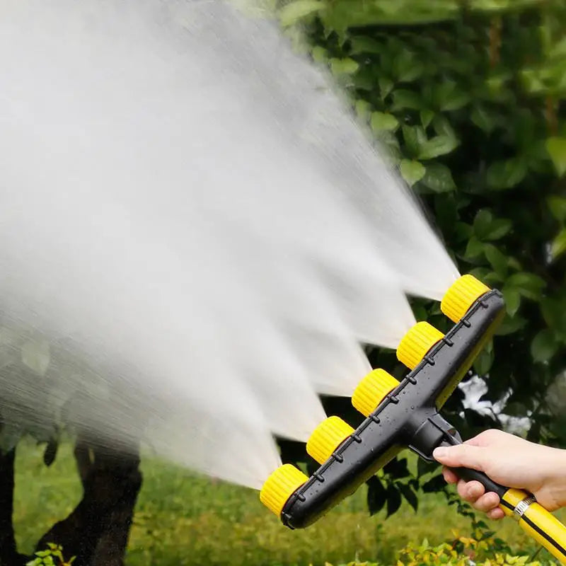 Adjustable garden and farm irrigation spray nozzle by Corporación Turística, with three atomizing spray heads for efficient watering.