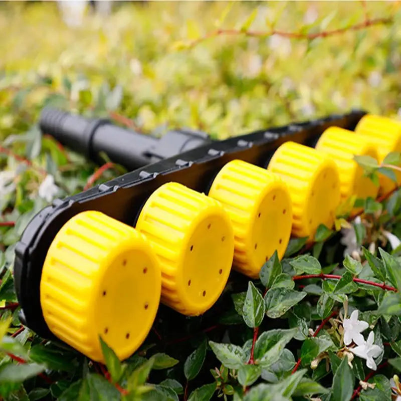 Adjustable garden and farm irrigation spray nozzles by Corporación Turística, featuring three atomizer heads for flexible watering.