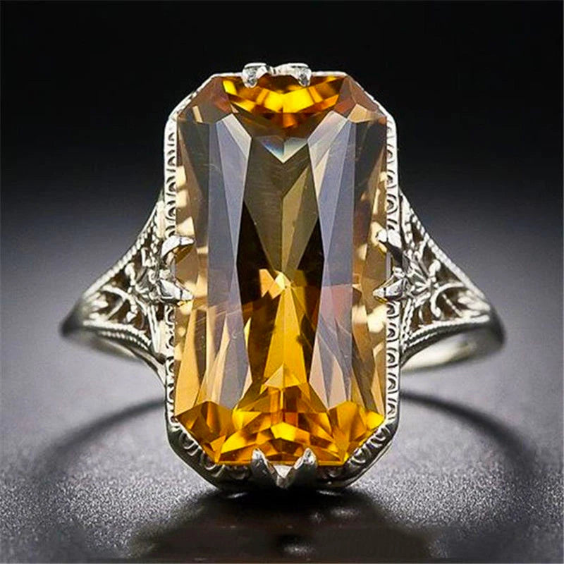 Retro square crystal ring by Corporación Turística featuring a hollow, carved design with a unique vintage style.