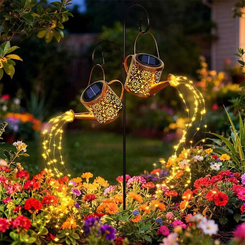 Two solar garden lamps by Corporación Turística with kettle and pole design, ideal for outdoor decoration and gift purposes.
