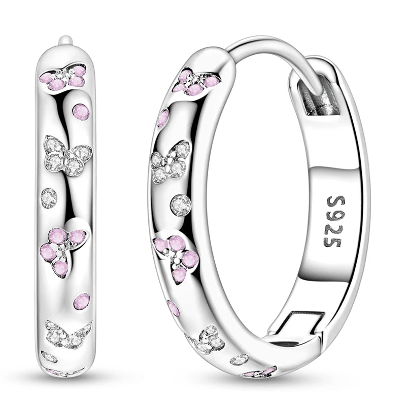 Sterling silver hoop earrings from Corporación Turística, stylish 925 silver jewelry with a modern design.