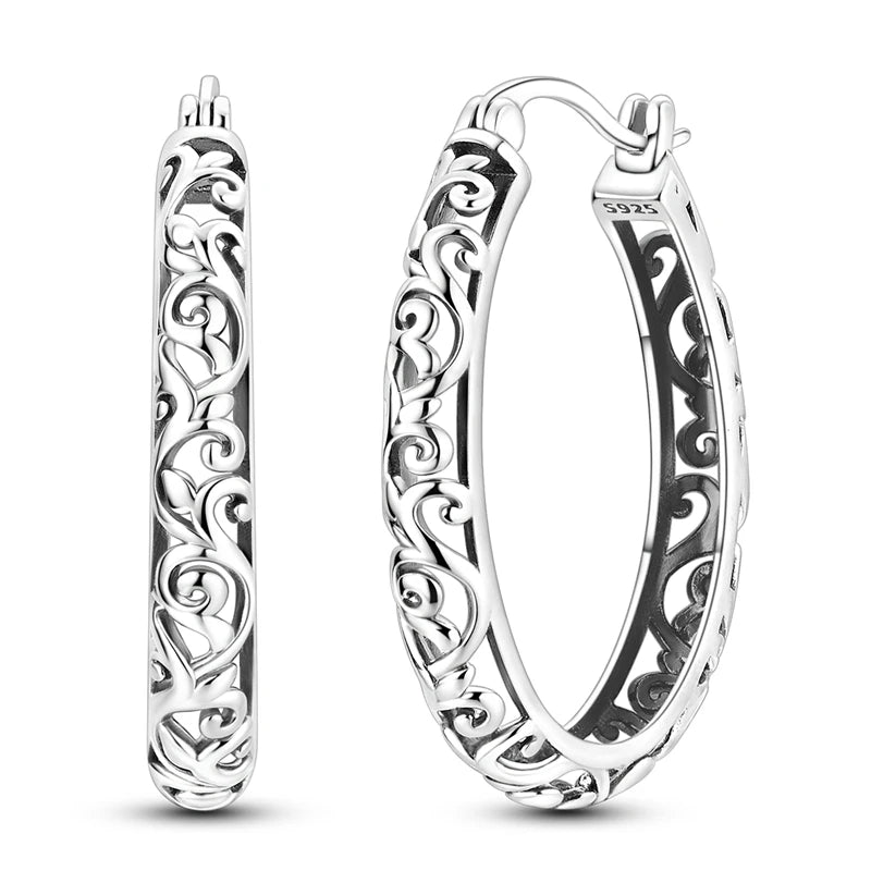Sterling silver hoop earrings from Corporación Turística, original design, crafted in 925 silver for elegant jewelry.