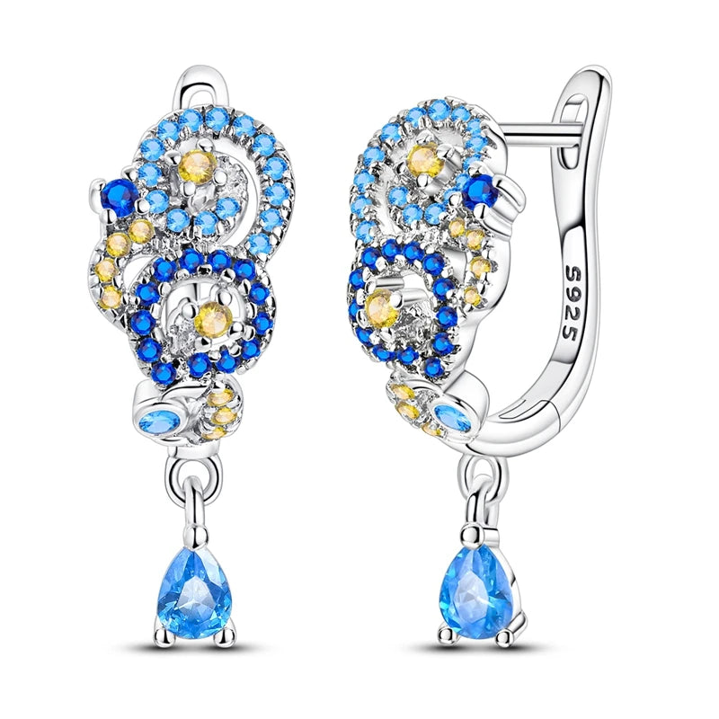 Starry Night Van Gogh silver earrings featuring a celestial design, showcasing intricate details and a polished finish.