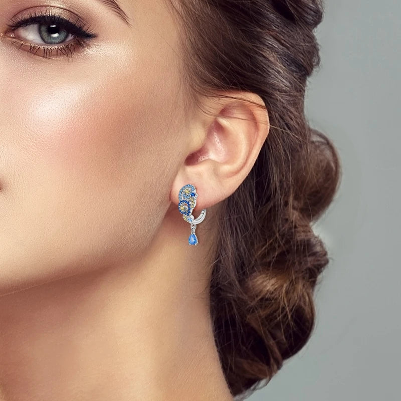 Starry Night Van Gogh silver earrings featuring night sky and star designs, crafted by Corporación Turística.