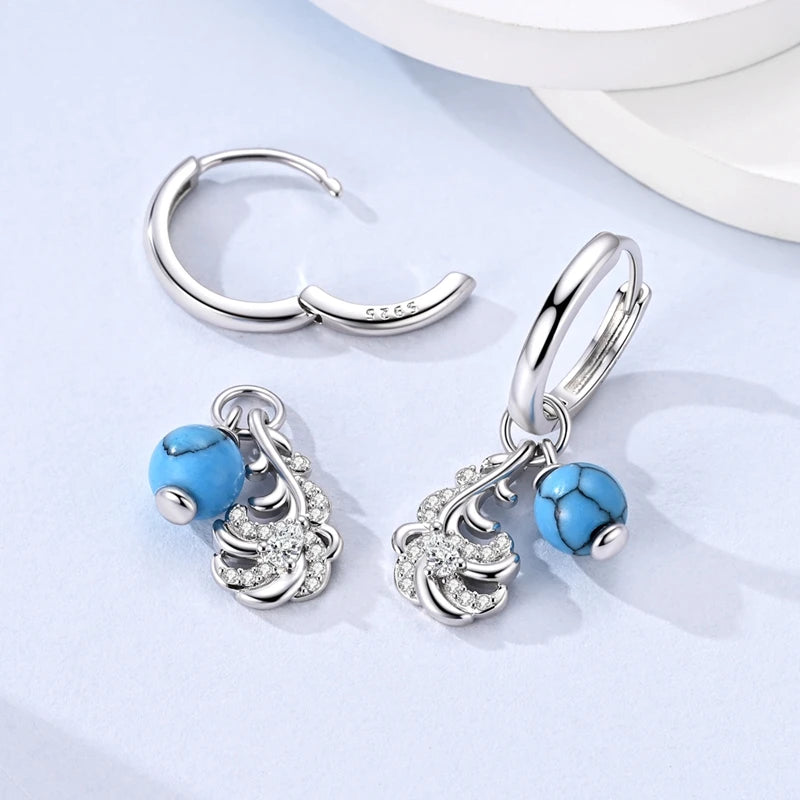 Sterling silver 925 women's earrings with sparkling cubic zirconia, featuring elegant dangle design and shiny finish.