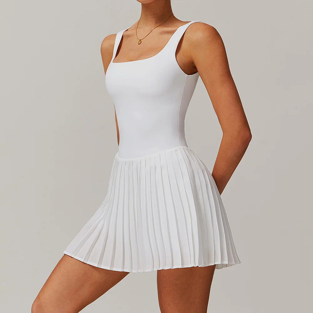 Lavender purple yoga set with tennis dress and jumpsuit for women by Corporación Turística, displayed on a mannequin.