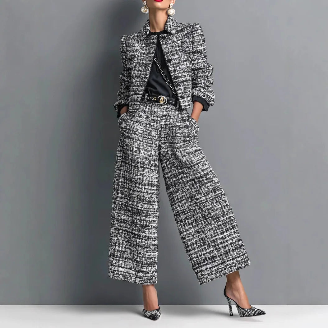 Light blue women's 2-piece set with short jacket from Corporación Turística, featuring a stylish cropped jacket and matching pants.