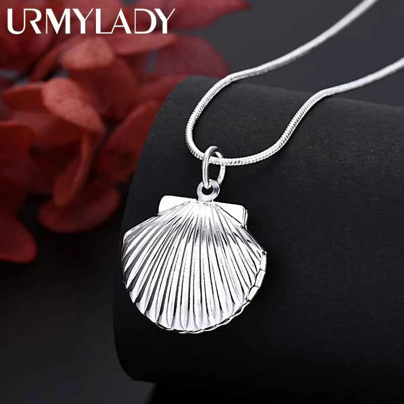 Sterling silver 925 shell pendant necklace, 40-75cm length, new arrival, displayed on a jewelry stand with a shell design.