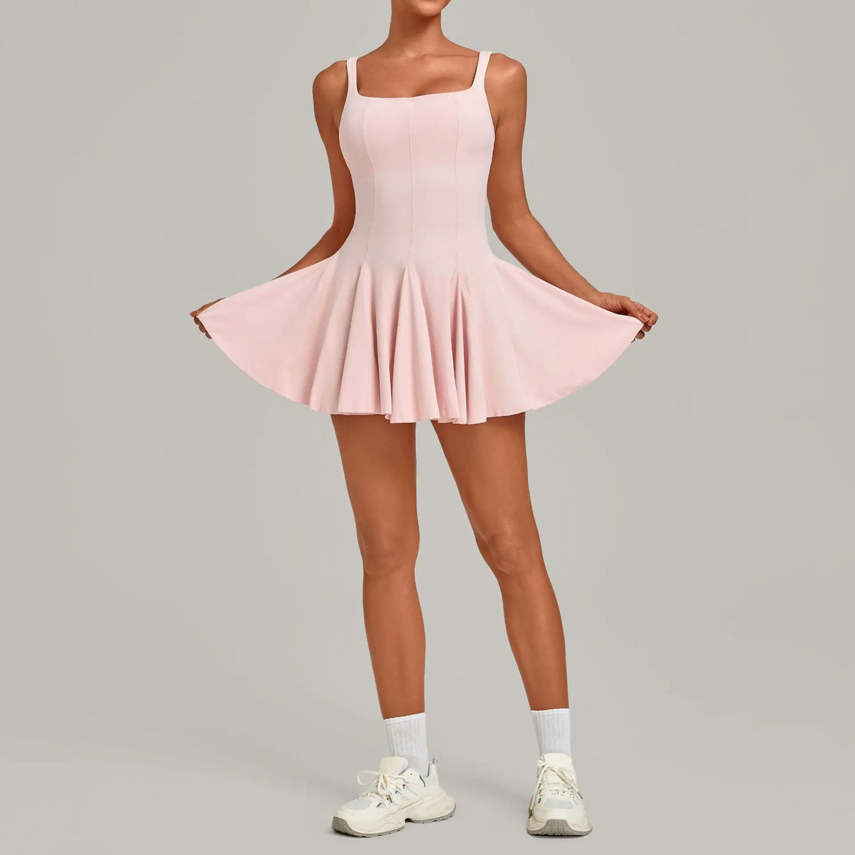 Marfil short sleeveless backless tennis dress with pockets by Corporación Turística, designed for athletic style and comfort.