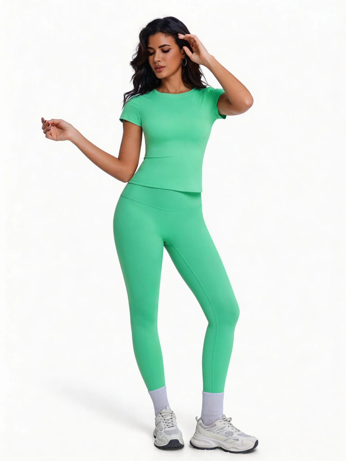 Corporaión Turística women's 2-piece sports set with a white athletic t-shirt and matching workout leggings, casual activewear.