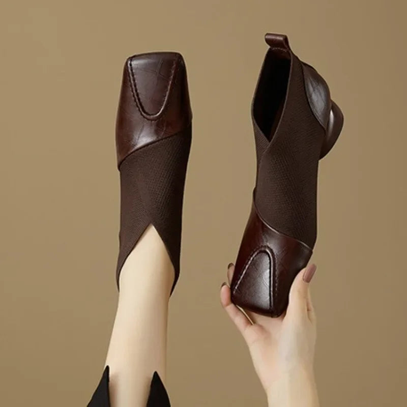 Maroon ankle boots with block heel and square toe from Corporación Turística, stylish footwear for casual or formal wear.