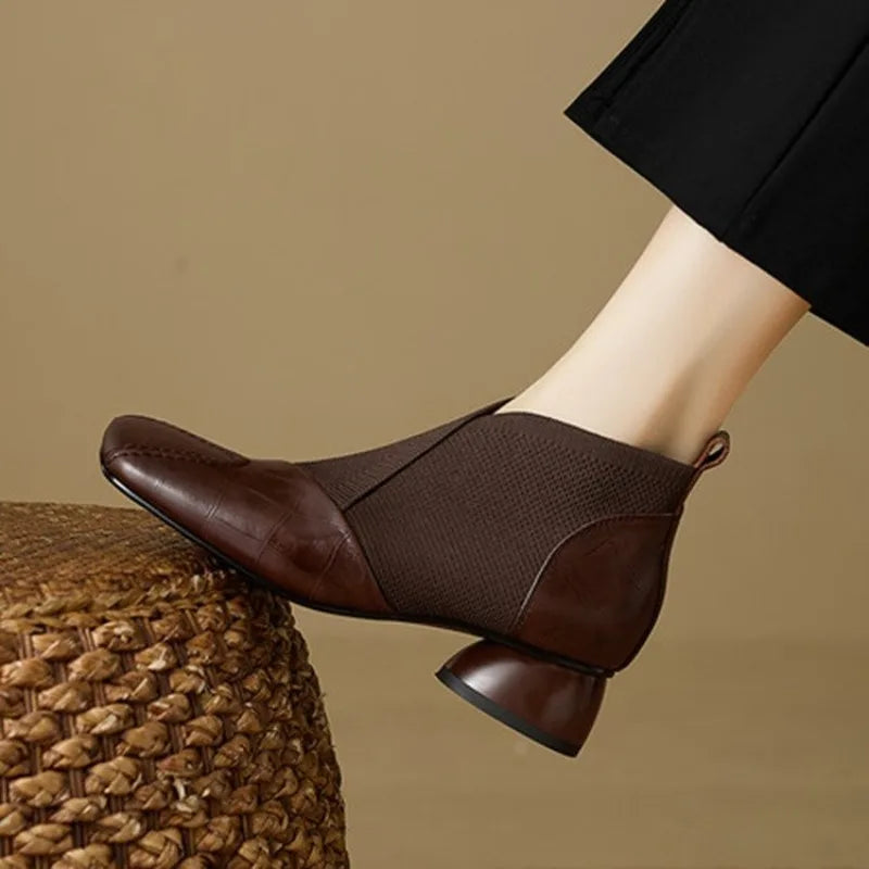 Brown ankle boots by Corporación Turística with block heels and square toes, stylish and comfortable for everyday wear.