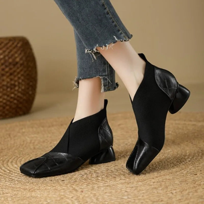 Brown ankle boots with block heels and square toes from Corporación Turística, styled with a sleek and modern design.