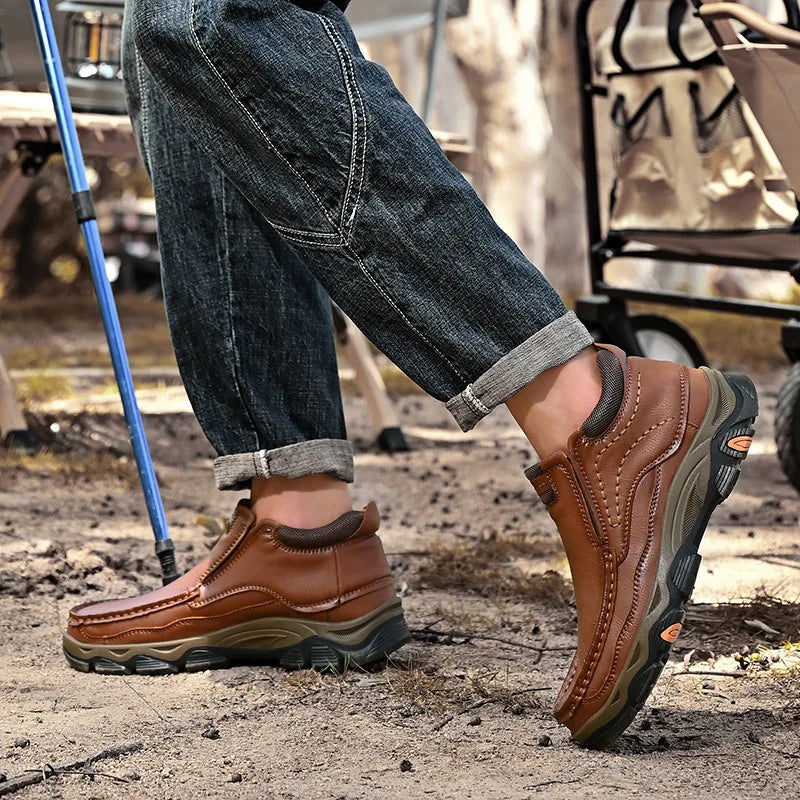 Brown genuine leather men's sports sneakers from Corporación Turística with white soles and stylish design.