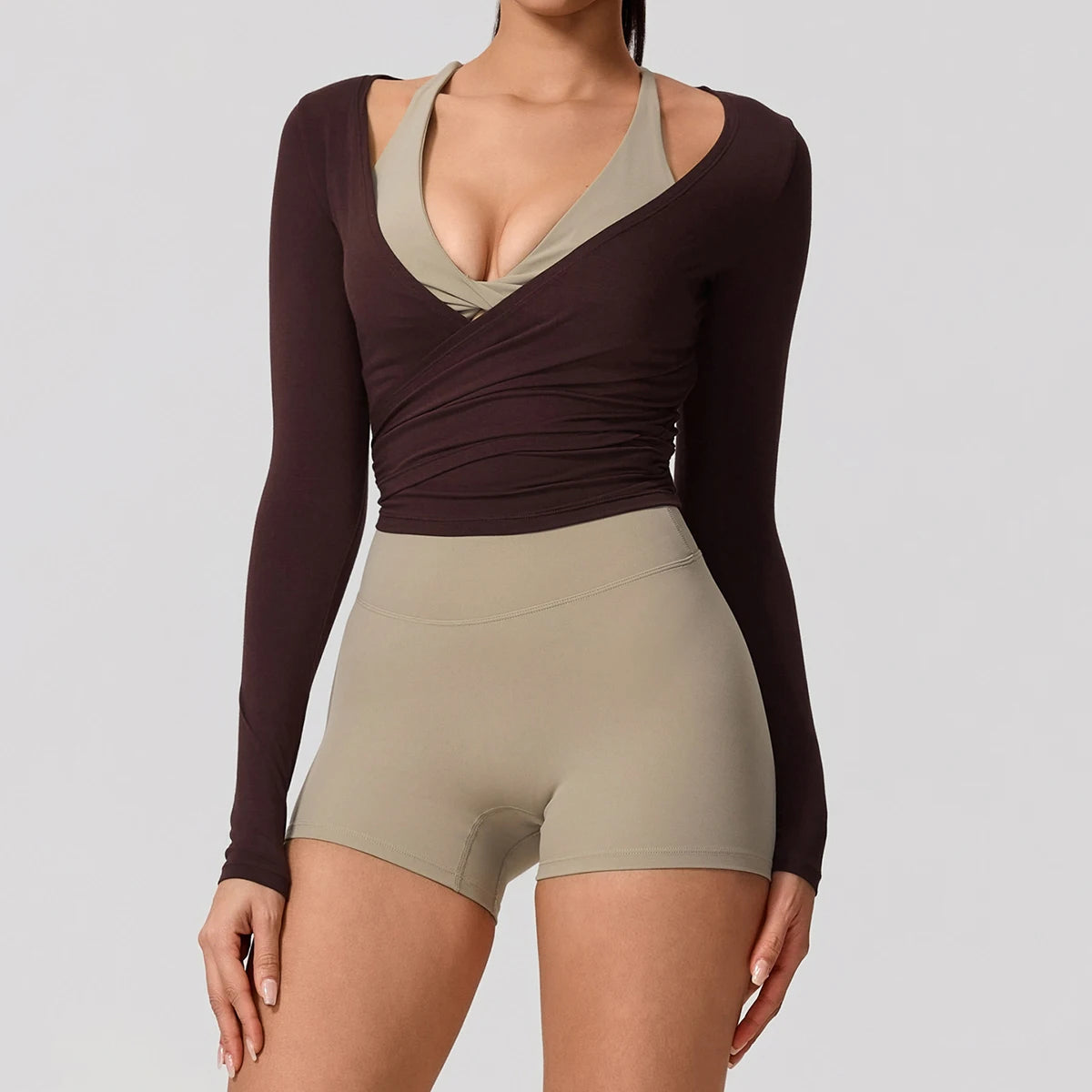 Long-sleeve summer yoga top for women from Corporación Turística, in soft milk tea color, designed for comfortable active wear