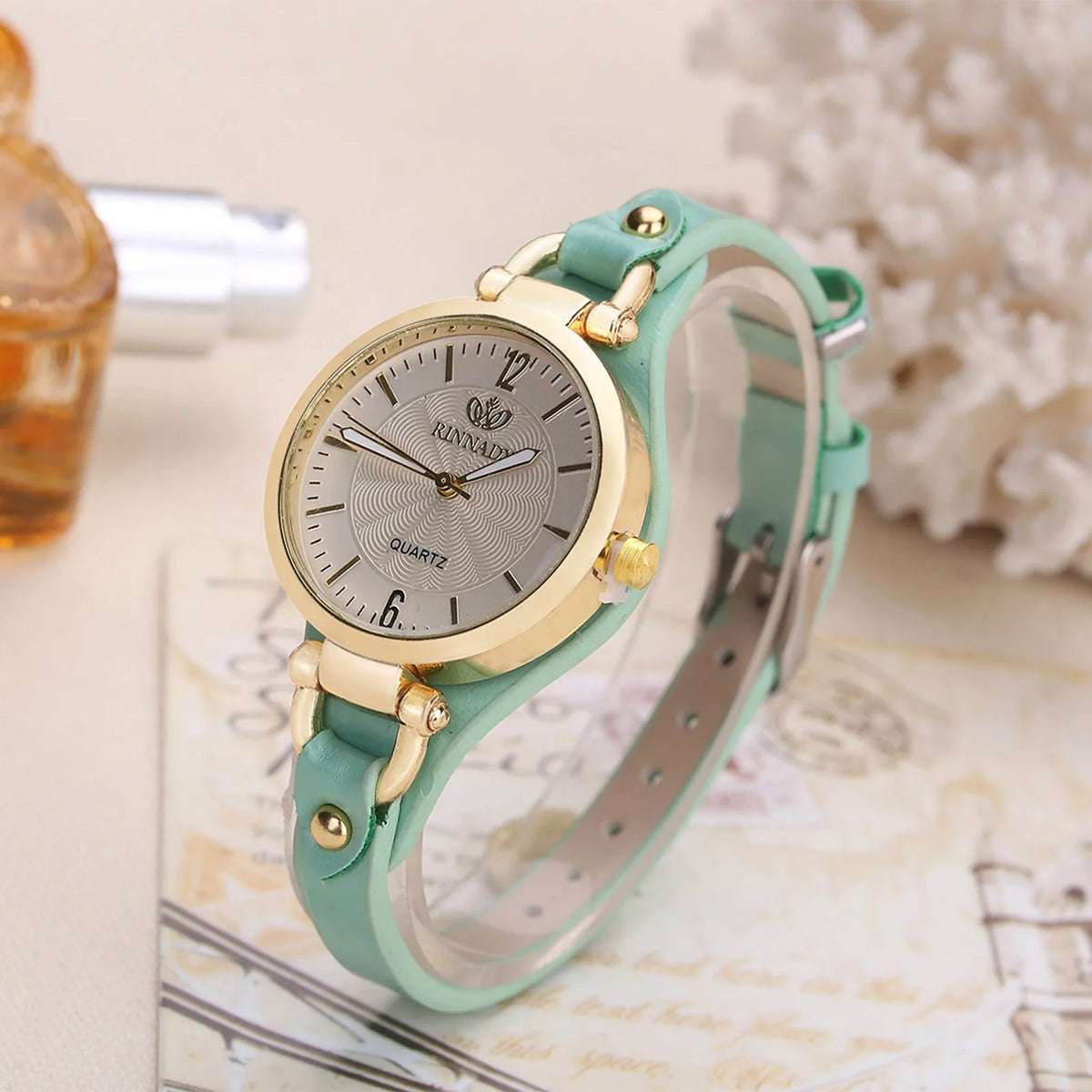 Mint green women's fashion quartz watch by Corporación Turística, featuring a sleek round dial and elegant strap.