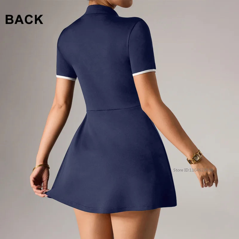 Navy blue women's short sleeve tennis dress with polo collar by Corporación Turística, ideal for sports and casual wear.