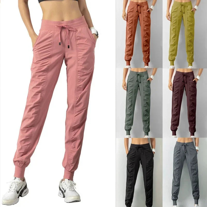 Navy blue women's sweatpants with drawstring, casual athletic joggers made of soft fabric from Corporación Turística.