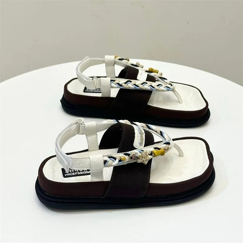 High-heeled pointed toe shoes with bow by Corporación Turística, black stilettos with elegant design and slender heels.