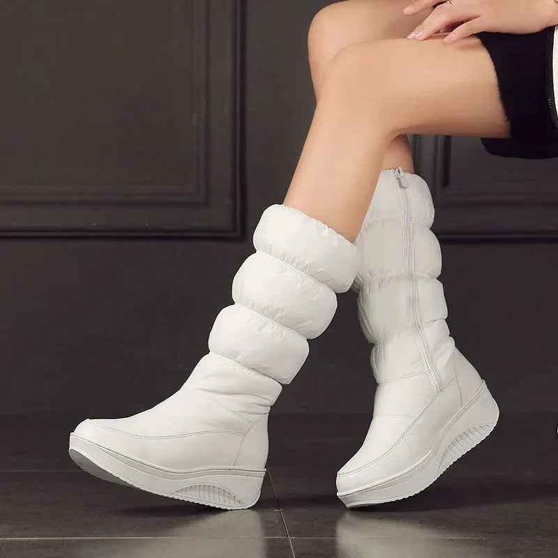 Women's waterproof snow boots by Corporación Turística in black with platform soles, designed for winter outdoor wear.