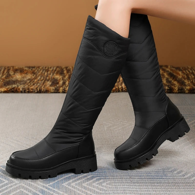 White women's winter snow boots made of warm leather by Corporación Turística, featuring a cozy design and sturdy soles.