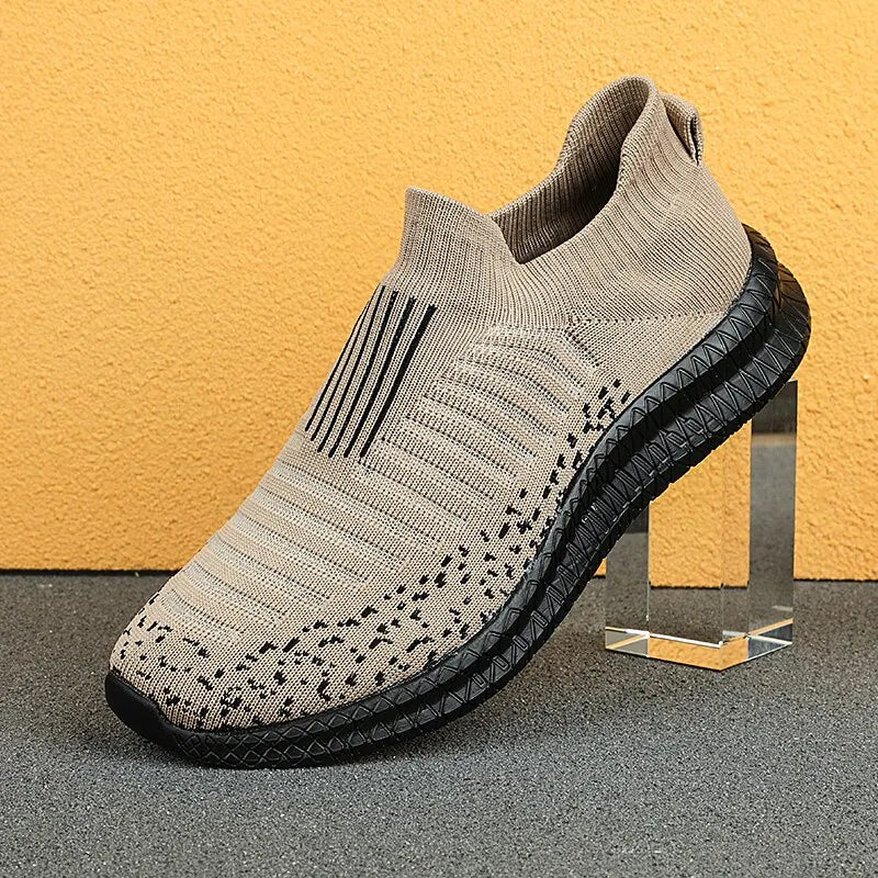 Black men's breathable sneakers by Corporación Turística, lightweight athletic shoes with comfortable design for everyday wear.