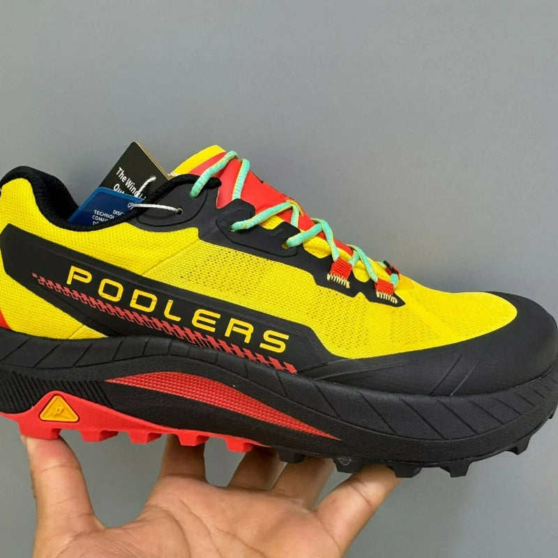Black running shoes by Corporación Turística for men and women, featuring a sleek design and cushioned sole for comfort.