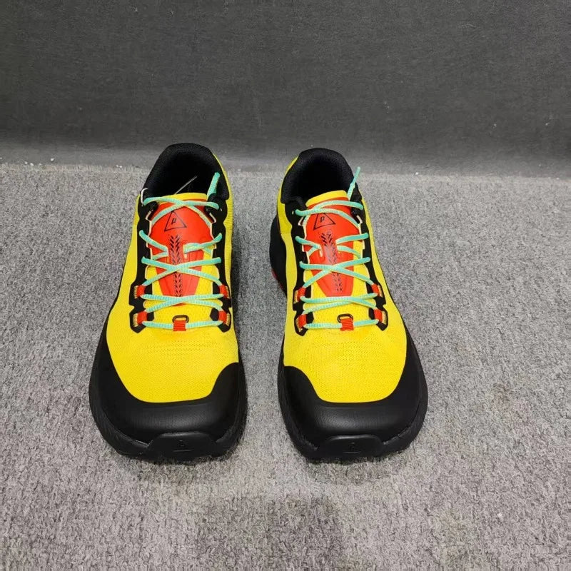 Black professional running shoes for men and women by Corporación Turística, showing the sleek design and breathable material.