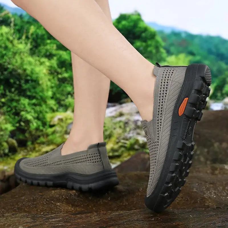 Black men's summer breathable mesh shoes by Corporación Turística, lightweight and comfortable for warm weather.