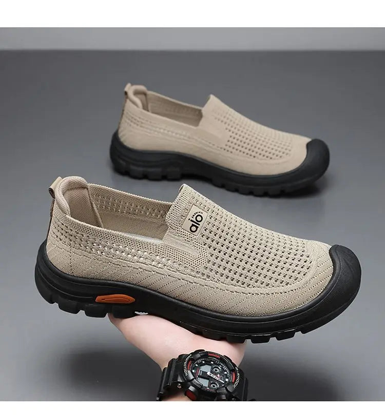 Black men's summer breathable mesh shoes by Corporación Turística, lightweight and comfortable for warm weather.