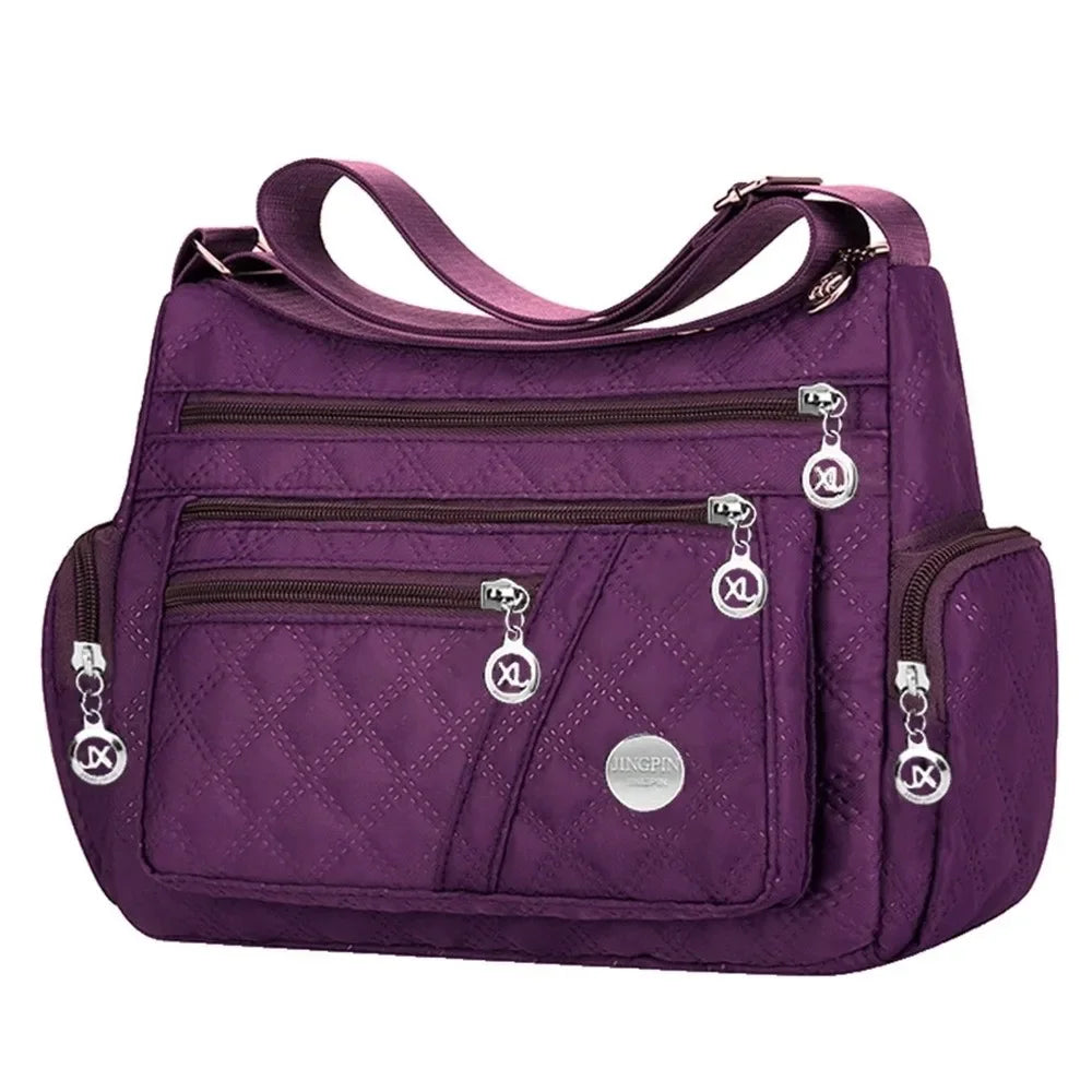 Nylon padded crossbody bag in black with Pomelo Best logo, suitable for women, featuring a sleek design and adjustable strap.
