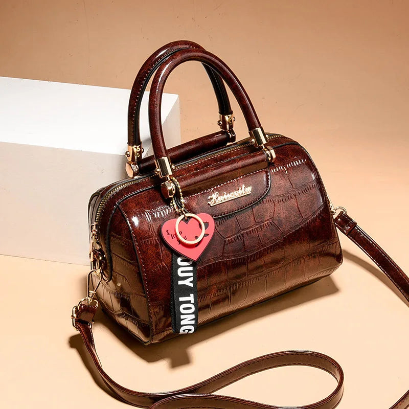 Luxury designer women's shoulder bag in black with sleek, structured style and elegant details from Corporación Turística.