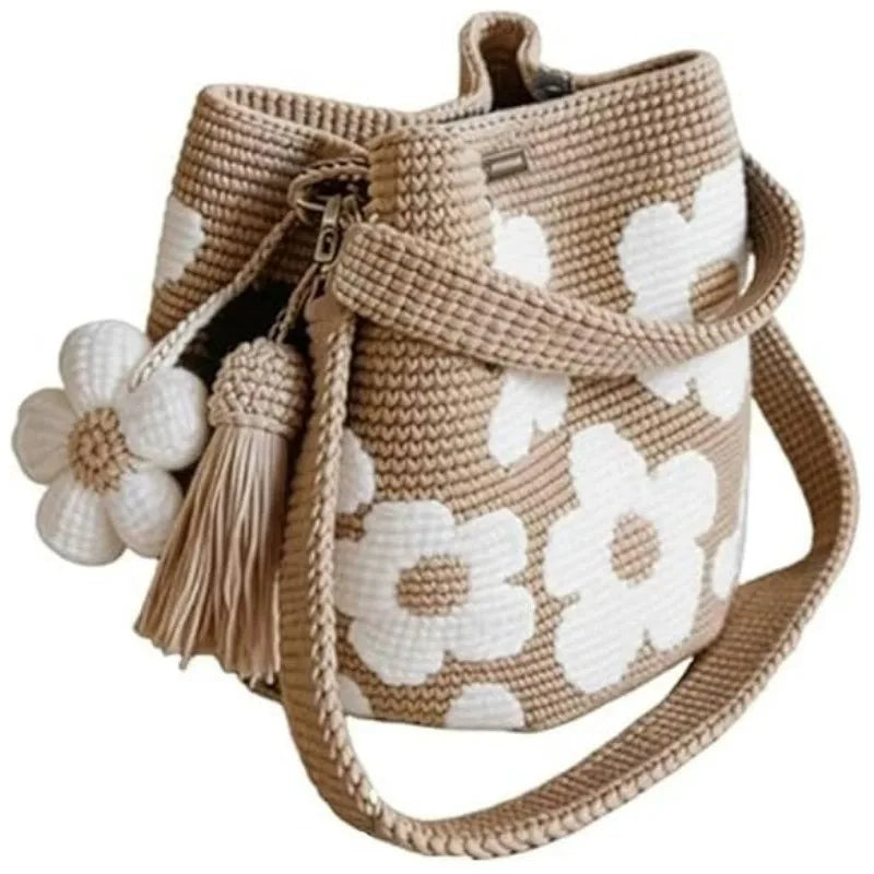 Handmade black crochet handbag with colorful floral accents, crafted by Corporación Turística for stylish carry.