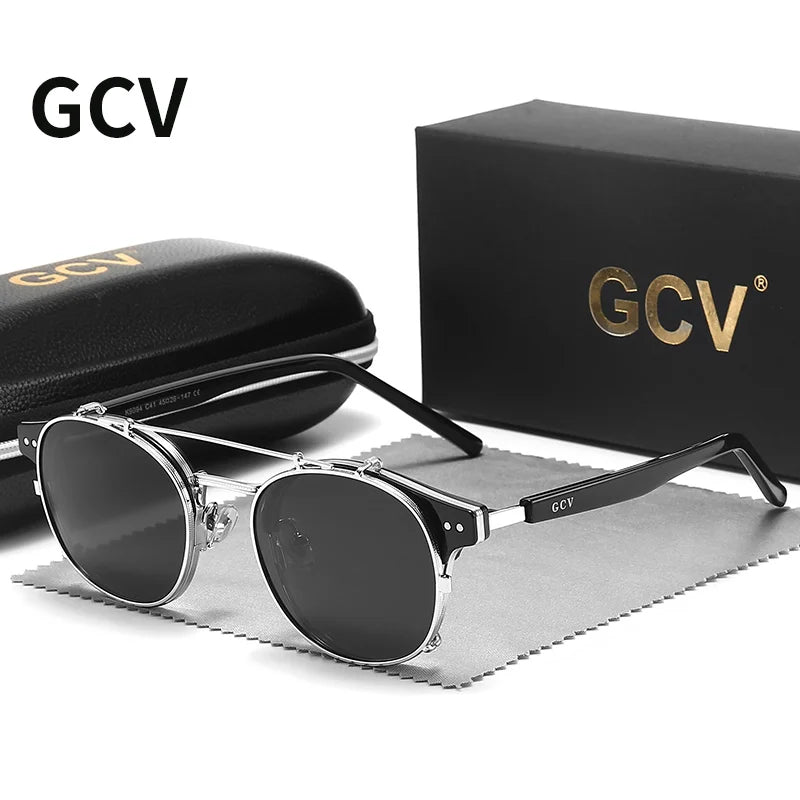 Black and gold GCV sunglasses with removable double-layer lenses by Corporación Turística, featuring a sleek design and stylish frame.