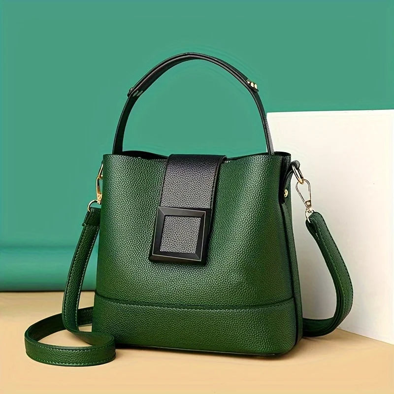 Elegant black solid color bucket bag with adjustable shoulder strap from Corporación Turística, stylish and versatile for daily use.