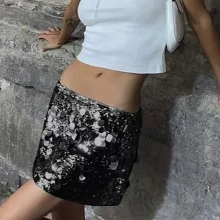 Black sequin skirt for women, casual style, by Corporación Turística, shown with a flowy design and shiny sequin details.