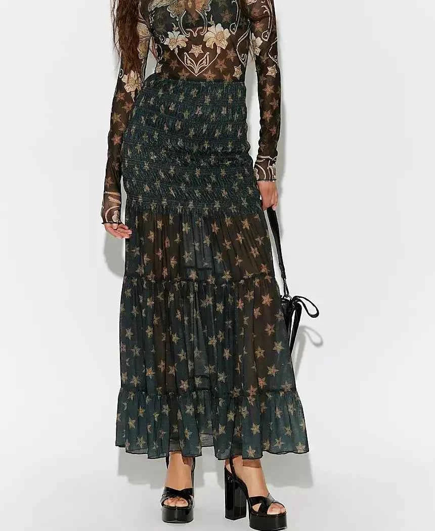 Elegant black flowing skirt for women, long with ruffle details, by Corporación Turística, suitable for stylish occasions.