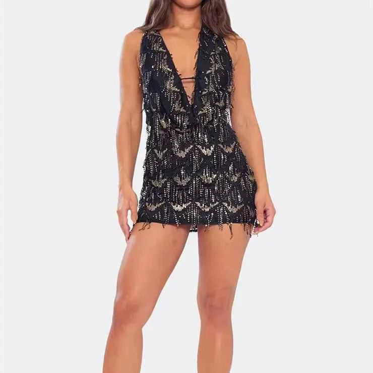 Black mini halter dress with sequins for women, featuring a high neckline and fitted silhouette, by Corporación Turística.