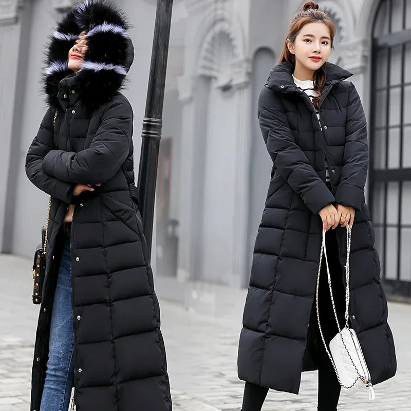 Long black winter coat for women by Corporación Turística, warm and stylish, shown on a model.