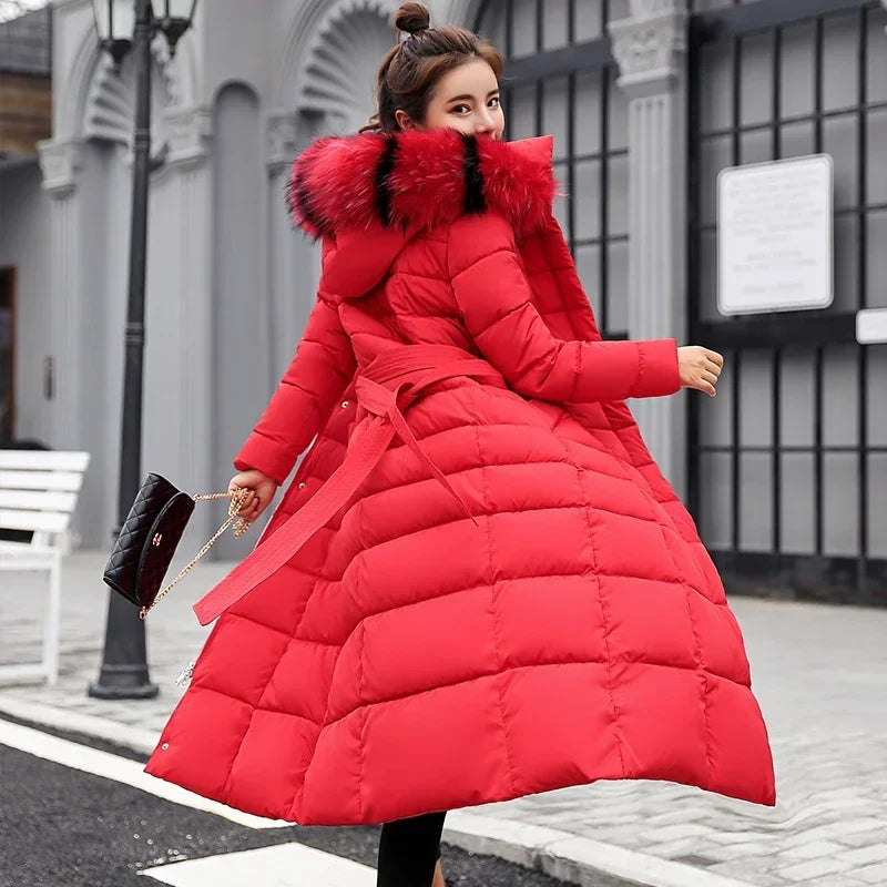 Long black winter coat for women by Corporación Turística, warm and stylish with a sleek fit and button details.