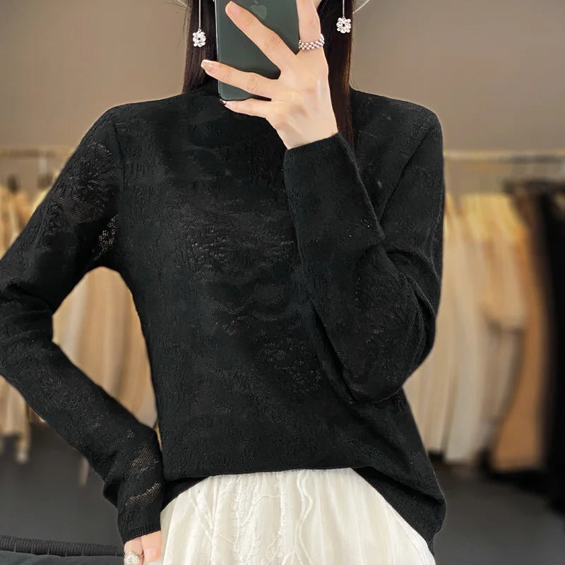 Black wool knit sweater with a high collar, designed for autumn and winter, by Corporación Turística.